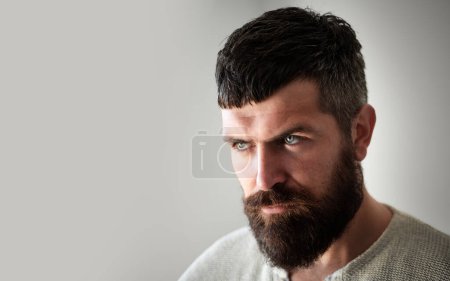 Bearded man. Beard Care. Facial Hair. Beard Styles and Male Grooming. Facial Hair Trends. Beard Beauty Care Products. Cosmetics for bearded man with mustache. Sexy man with Long Beard
