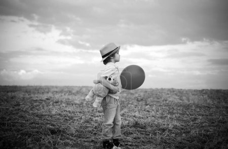 Freedom for kids. Imagination and freedom concept. Child dreams. Faith and trust. Kid having fun in spring field