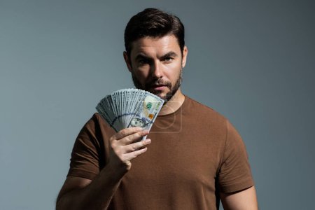 Man with dollars banknotes. Business man holding lots of 100 dollar bills. Easy money credit. Black cash. Payday and payment concept. Profit and richness. Earn money. Businessman successful deal