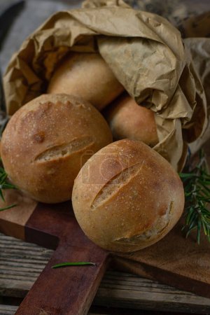 Photo for Healthy rosemary dinner bread buns with wholemeal flour - Royalty Free Image