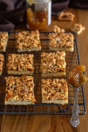 Photo for Fruit shortbread cookies jam squares with almonds - Royalty Free Image