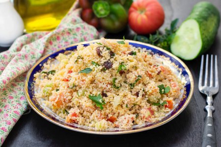 Photo for Traditional Mediterranean Levantine salad Tabbouleh with couscous semolina and fresh summer vegetables - Royalty Free Image