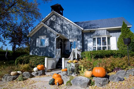 Photo for Violet Hill, Ontario / Canada - 10/10/2018: Halloween decoration with pumpkins on a Victorian-style house - Royalty Free Image