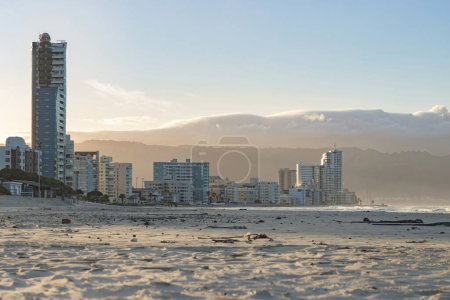 Photo for Strand Beach landscape of buildings during early morning sunrise with beach sand foreground - Royalty Free Image