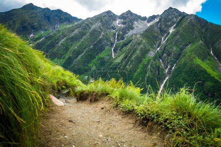 Photo for Trekking trail with Beautiful mountains peaks and waterfalls in the background. Shrikhand Mahadev Kailash Himalaya Yatra. Himachal Pradesh India. - Royalty Free Image