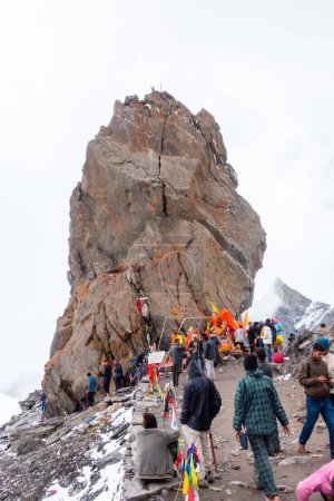 Photo for July 14th 2022, Himachal Pradesh India. Devotees offering their prayers at Shrikhand Mahadev Peak, the Shivling, a symbol of Lord Shiva. Kailash Yatra in the Himalayas. - Royalty Free Image