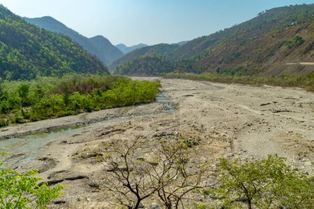 Vast Yamuna River semi-dried during summer at Maldevta region in Dehradun, Uttarakhand, with expansive valleys and mountains