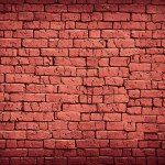 Background of old red brick wall with white paint