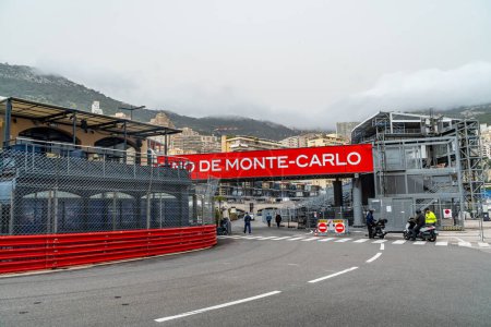 Photo for March 29, 2024. La Rascasse corner of the Monaco Formula 1 circuit, open to traffic, with the race fences mounted and the bar of the same name inside. - Royalty Free Image