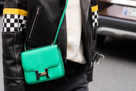 Photo for Paris, France - October, 1, 2022: woman wearing Constance green leather bag from Hermes, street style outfit details. - Royalty Free Image