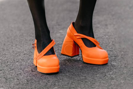 Photo for Milan, Italy - February, 23, 2022: woman wears orange high heel shoes, street style details - Royalty Free Image