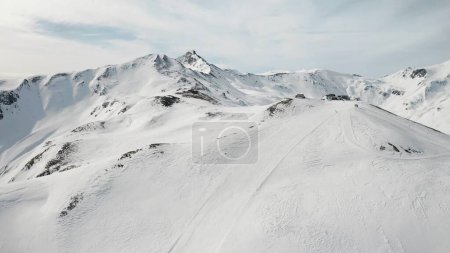 Photo for People snowboarding skiing at ski resort. Skiers, snowboarders riding snowy mountain slope. Outdoor winter sport and scinery panoramic view. - Royalty Free Image