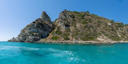View of coastline in southern Italy. Scenic view from on top cliff looking out to sea on sunny summer day. Calabria coastline with eroded cliff on beach