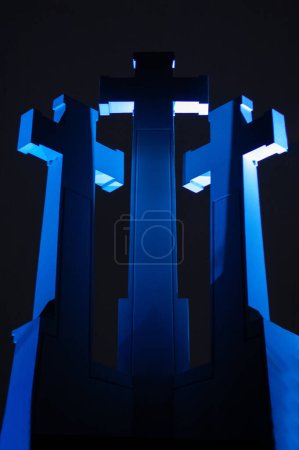 Three crosses monument at night with blue light in Vilnius, Lithuania, on the Hill of Three Crosses