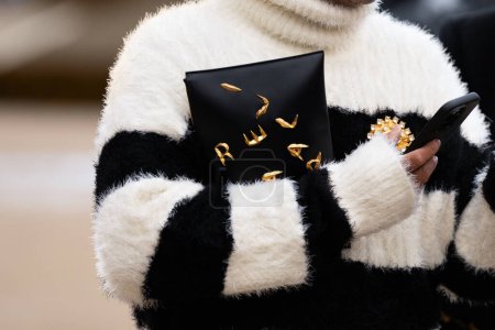 Photo for Paris, France - January, 22, 2024: man wears Schiaparelli clutch bag and accessories, fashion blogger outfit details, street style - Royalty Free Image