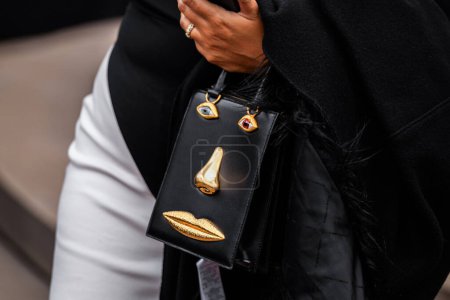 Photo for Paris, France - January, 22, 2024: woman wears anatomy jewelry Schiaparelli bag, fashion blogger outfit details, street style - Royalty Free Image