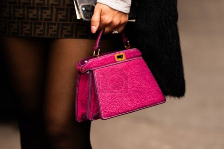 Photo for Milan, Italy - January, 13, 2024: woman wears Fendi Peekaboo bag, street style details, fashion outfit detail. - Royalty Free Image