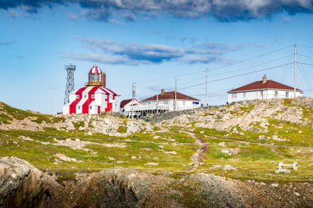 Photo for Red and white striped lighthouse popular landmark and historic building in Bonavista Newfoundland Canada. - Royalty Free Image