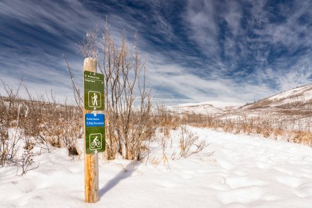 Photo for Cochrane Alberta Canada, March 17 2023: An E-bike and pedal assist friendly sign on a hiking trail at Glenbow Ranch Provincial Park. - Royalty Free Image