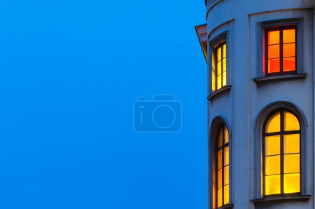 Colorful windows on building at dusk