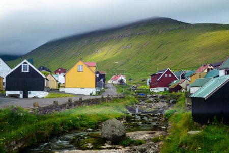 Photo for Houses at foot of green hill, Faroe Islands - Royalty Free Image