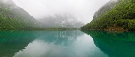Photo for Panorama view of still lake and mountain scenery, Norway - Royalty Free Image