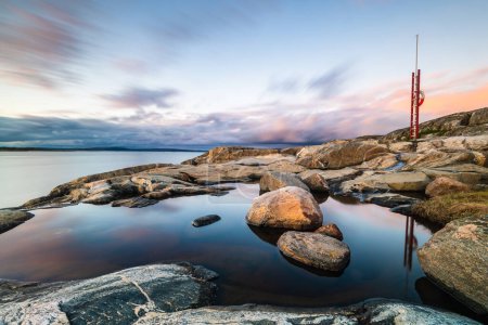 Coastal scene at sunset, Sweden.