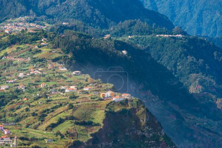 Photo for A breathtaking aerial view of the Madeira mountain range, showcasing its lush valleys and trees with tranquil plateaus. Nature at her finest! - Royalty Free Image