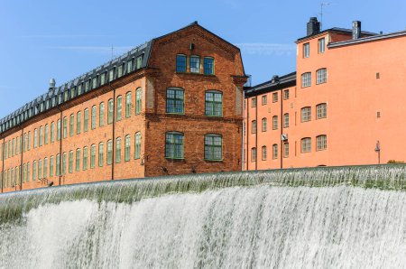 Photo for Waterfall in front of old industrial area - Royalty Free Image