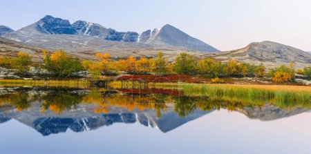 Photo for Reflection of mountains and trees in autumn landscape, Norway. - Royalty Free Image