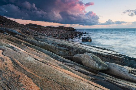 Photo for Coastal scene with sunset clouds, Sweden. - Royalty Free Image