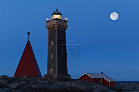 Photo for Lighthouse and wooden buildings in Vinga, Gothenburg, Sweden, Europe - Royalty Free Image