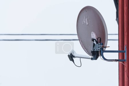 Photo for A grey parabolic dish on the side of a house - Royalty Free Image