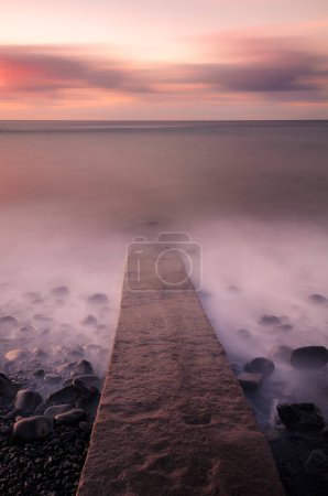 Photo for Stone jetty leading into the sea, Madeira. - Royalty Free Image