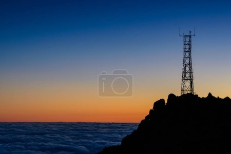 Photo for Silhouette of mast high up on mountain - Royalty Free Image