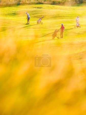 Photo for Grass in front of people on golf course - Royalty Free Image