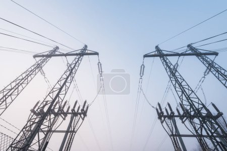Photo for Electrical power lines in mist - Royalty Free Image