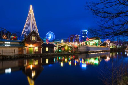 GOTHENBURG, SWEDEN - DECEMBER 3, 2015: Reflection of amusement park in night