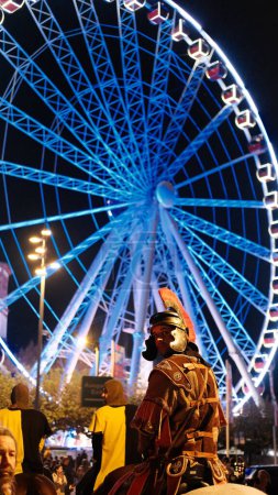 Photo for Celebration of Saint Martin day. Saint Martin of Tours sitting on the horse the front of Ferris wheel glowing in the night. Man in armor. Dusseldorf .Germany .10.11.22. High quality photo - Royalty Free Image