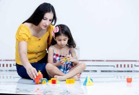 Photo for Playful mother and daughter having fun with each other at home,Indian mother and daughter having fun together - Royalty Free Image