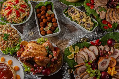 Photo for Christmas dinner. With roast turkey and foods served in Brazil. Traditional Christmas table served in Brazil, decorated. Family dinner. top view - Royalty Free Image