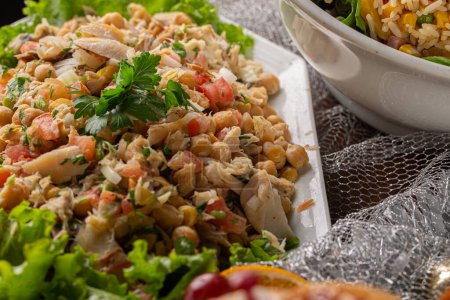 Photo for Cod salad with chickpeas. dish served at Festive dinner. Festive Salad. - Royalty Free Image