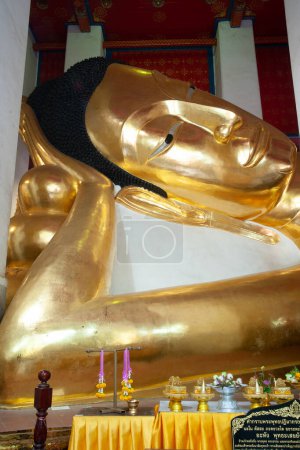 The large golden reclining Buddha has a very beautiful Sukhothai Buddhist style. It is 47 meters and 42 centimeters long and is the third largest in Thailand.Located at Wat Phra Non Chakkasi Worawihan temple , Sing Buri Province in Thailand.