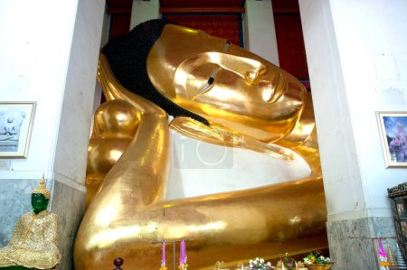 The large golden reclining Buddha has a very beautiful Sukhothai Buddhist style. It is 47 meters and 42 centimeters long and is the third largest in Thailand.Located at Wat Phra Non Chakkasi Worawihan temple , Sing Buri Province in Thailand.