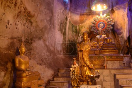 Buddha images in various postures are enshrined inside the famous Tham Khao Yoi Temple. And there are beautiful stalagmites and stalactites. Located at Phetchaburi Province in Thailand.