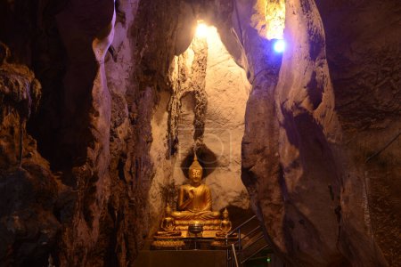 Buddha images in various postures are enshrined inside the famous Tham Khao Yoi Temple. And there are beautiful stalagmites and stalactites. Located at Phetchaburi Province in Thailand.