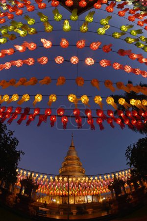 Evening time of Hundred Thousand Lantern Festival at Wat Phra That Hariphunchai. It is an offering of a lantern as a Buddhist offering. It is a tradition that is held every year and is part of the Loy Krathong tradition. Located in Thailand.