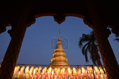 Evening time of Hundred Thousand Lantern Festival at Wat Phra That Hariphunchai. It is an offering of a lantern as a Buddhist offering. It is a tradition that is held every year and is part of the Loy Krathong tradition. Located in Thailand.