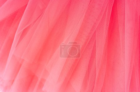 Photo for Pink background of tulle fabric close-up. - Royalty Free Image