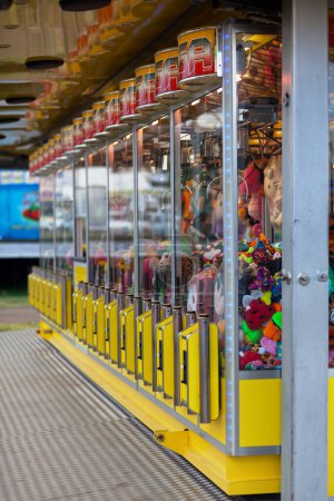 Photo for Saint Denis, Reunion - August 13 2016: Row of toy cranes arcade games in a carnival. - Royalty Free Image